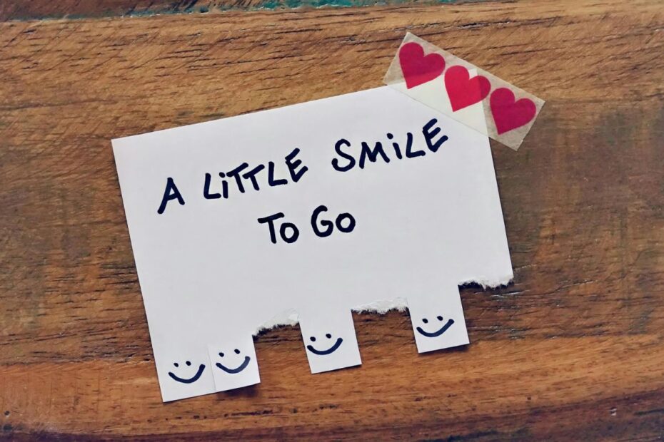 Free a little smile to go sign with smiley face tabs to tear off